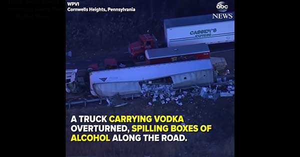 overturned truck spill vodka accident damage 1